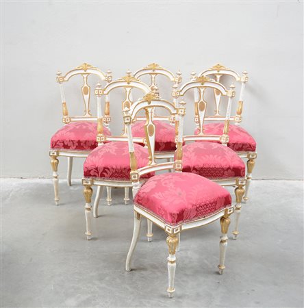 Gruppo di sei sedie in legno laccato bianco con filettature e fregi dorati,...