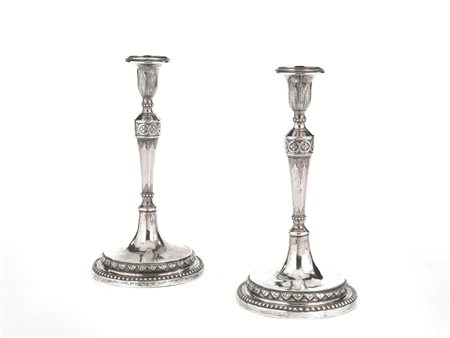 Coppia candelieri, inizi sec. XIX, in argento, fusto troncopiramidale...