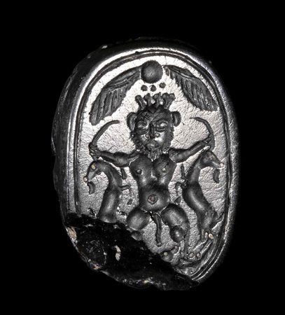 A LARGE PHOENICIAN BLACK JASPER ENGRAVED SCARAB. BES WITH ANIMALS. 