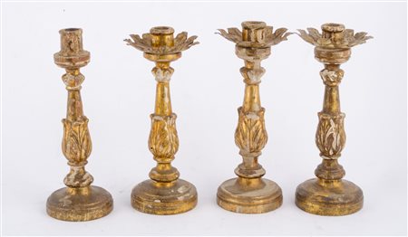 QUATTRO CANDELIERI in legno dorato ad argento a mecca. Sicilia XIX secolo...