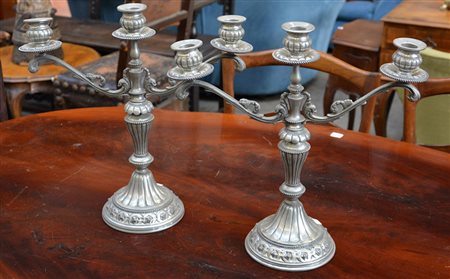 Lotto di due candelieri in peltro a tre fiamme (h cm 35) (difetti)