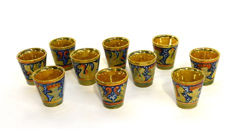 Manifattura di Gubbio. Gruppo di dieci bicchierini in terracotta decorati a...