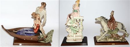 Lotto di tre sculture in resina sintetica raffiguranti una amazzone e due...
