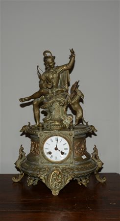 Pendola da camino in metallo decorato da cacciatore e cane con preda....