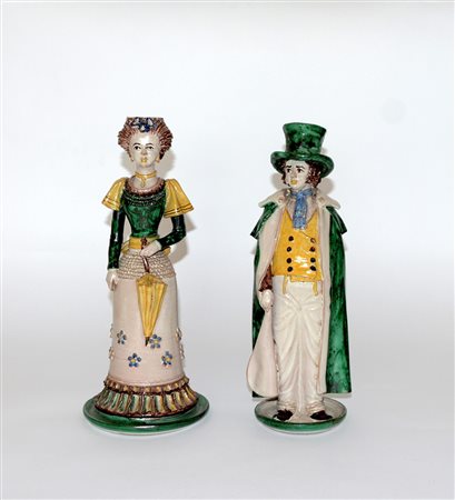 Manifattura di Caltagirone, lotto di due statuine portaceri in ceramica...
