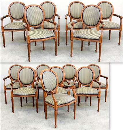 * Gruppo di quattordici poltrone con braccioli mossi, gambe scanalate...