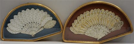 Due ventagli in avorio di cui uno con carta e decoro in oro, e l'altro in...