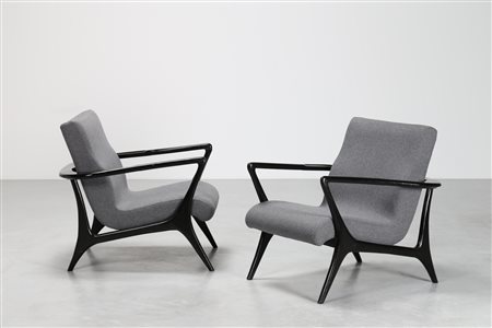 KAGAN VLADIMIR Attrib. Coppia poltrone in tessuto e legno laccato nero di...