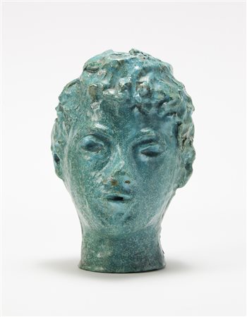 "Testa di fanciullo", scultura in terracotta smaltata in verde. Italia,...
