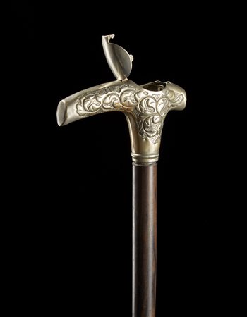 Bastone con canna in legno ebanizzato e impugnatura in metallo con...