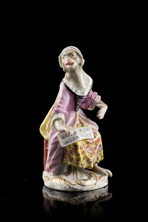 Statuina in porcellana decorata in policromia raffigurante una scimmia in...