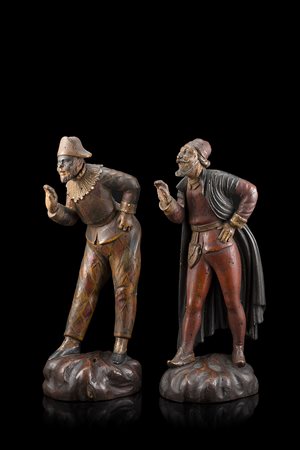 Due statuette in legno laccato raffiguranti Arlecchino e Balanzone. Veneto,...