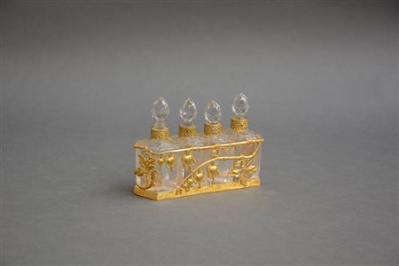 Manifattura del sec. XIX. Gruppo di quattro bottiglie di forma sfaccettata...