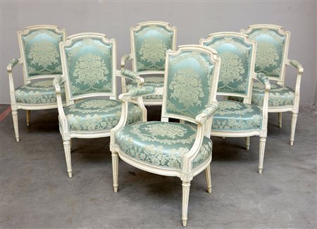 Gruppo di sei poltrone in legno laccato, schienale a scudo, braccioli a...