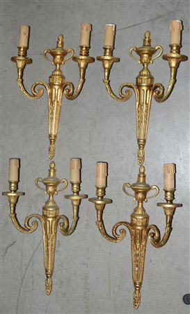 Lotto di quattro applique a due luci in bronzo dorato (h cm 40 circa) (difetti)