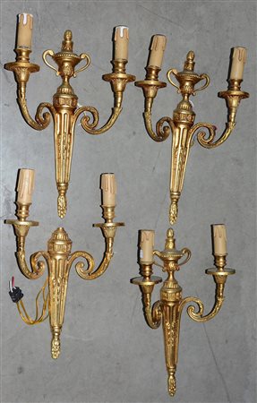 Lotto di quattro applique a due luci in bronzo dorato (h cm 40 circa) (difetti)