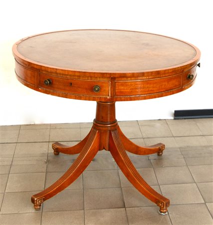 Tavolo tondo a tamburo con quattro cassetti nella fascia e piano ricoperto in...