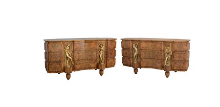 Coppia di credenze dÈco lastronate in radica con decoro a bugne, fronte mosso...