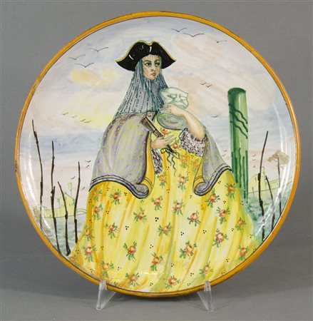 Guerrieri: piatto in ceramica smaltata raffigurante maschera. Firmato sotto...