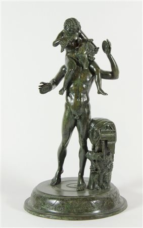 Scultura in bronzo a patina verde raffigurante Bacco e putto. H. cm. 46.