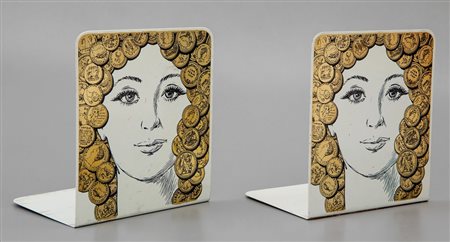 PIERO FORNASETTI Una coppia di fermalibri decoro "Viso con monete", anni '60....