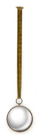 PIERO FORNASETTIUno specchio da parete anni '50.Ottone, cristallo curvato...