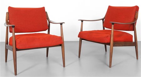 DUE POLTRONE, anni '50. Legno di teak, imbottiture rivestite in tessuto....