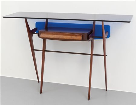 UNA CONSOLLE, anni '50. Legno di mogano, ottone, legno impiallacciato in...