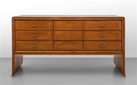 UNA CASSETTIERA, anni '40. Legno impiallacciato in palissandro, ottone. Cm 85...