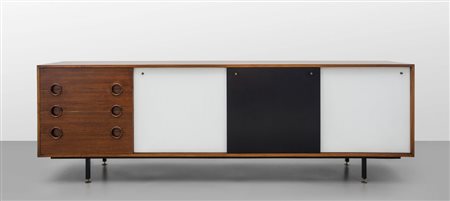 UNA CREDENZA, anni '60. Legno di palissandro, legno impiallacciato in...