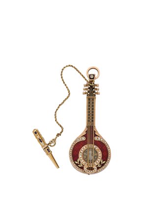 ANONIMO Orologio a forma di mandolino in oro 18K e smalti Epoca inizio sec....