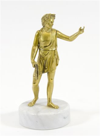 Scultura in bronzo dorato raffigurante personaggio, su base circolare in...