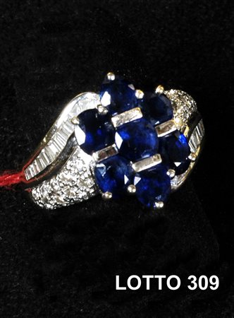 ANELLO IN ORO GIALLO CON 7 ZAFFIRI E BRILLANTI GRAMMI TOT. 8,30 ORO 750 %...