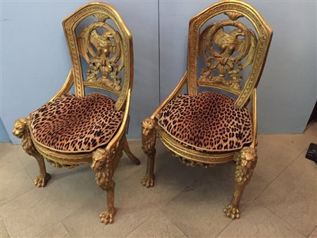 COPPIA DI SEDIE, Coppia di sedie dorate con ricco intervento di intaglio allo...