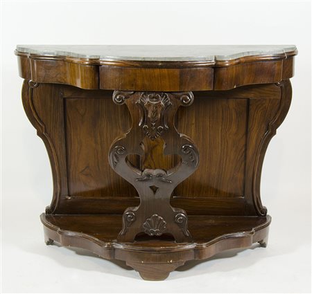 Consolle in legno su gamba centrale riccamente scolpita, piano sagomato in...