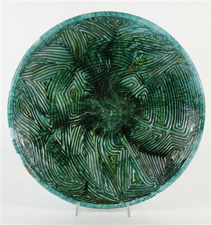 Torviscosa: piatto in ceramica smaltata verde. Firmato sotto la base e datato...