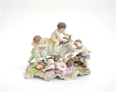 Gruppo in porcellana policroma raffigurante putti con caprone (cm 35x40)...