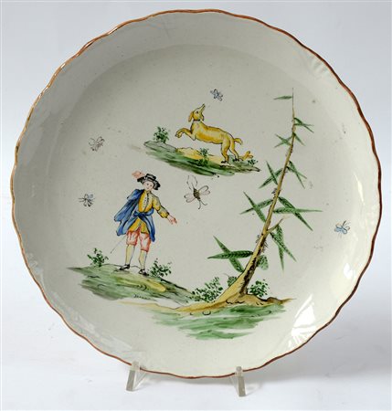 Manifattura S.C.I. Laveno, piatto istoriato in ceramica con bordo mosso...