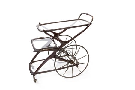 CARRELLO Portavivande in mogano e ottone, piani in cristallo. Vassoio...