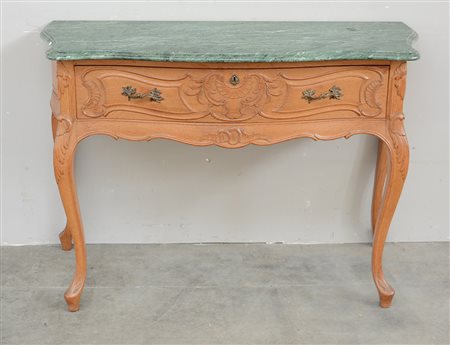 Consolle di forma sagomata in rovere ad un cassetto sottopiano. Gambe e...