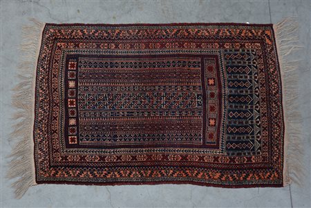 [Tappeti] Tappeto Afghan, sec. XX. Disegno geometrico nei toni dell'arancio,...