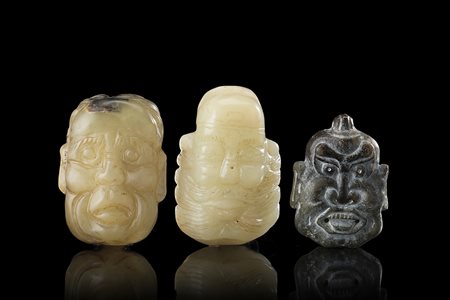 Tre maschere in giada color celadon e grigia Cina, sec. XX Three celadon and...