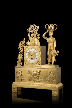 MARION FILSPendola in bronzo dorato sormontato da acquaiolaAnni 1820/1830...