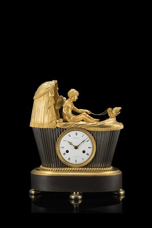 SCHMIT A PARIS Pendola in bronzo dorato e brunito a forma di culla con...