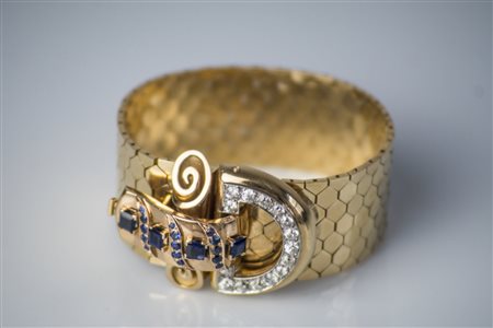 Bracciale in oro 18kt, gr 98.50. Con fibia in zaffiri naturali e sintetici....
