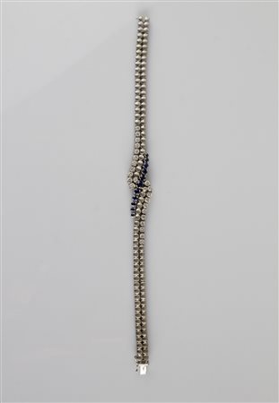 Bracciale snodato in oro bianco 18kt, gr 25.60. Diamanti cts 1.3 circa....