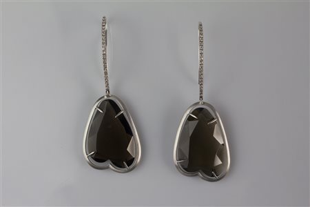 Orecchini in oro bianco, gr 7.90. Diamanti cts 0.34 e quarzi fumè. Firmati...