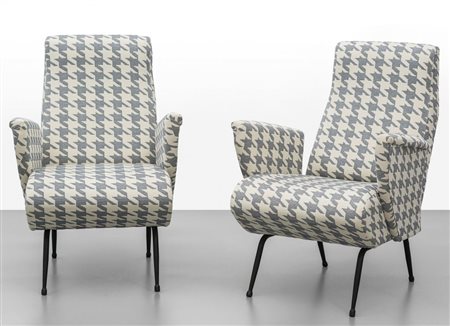 DUE POLTRONE, ANNI '60.Ferro verniciato, imbottiture rivestite in...