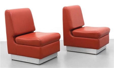 DUE POLTRONE, anni '60. Panforte rivestito di alluminio satinato, vinilpelle....