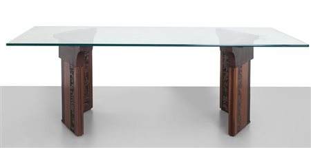 GIAN PAOLO ZALTRON Un tavolo, anni "60. Legno di noce con parti intagliate,...